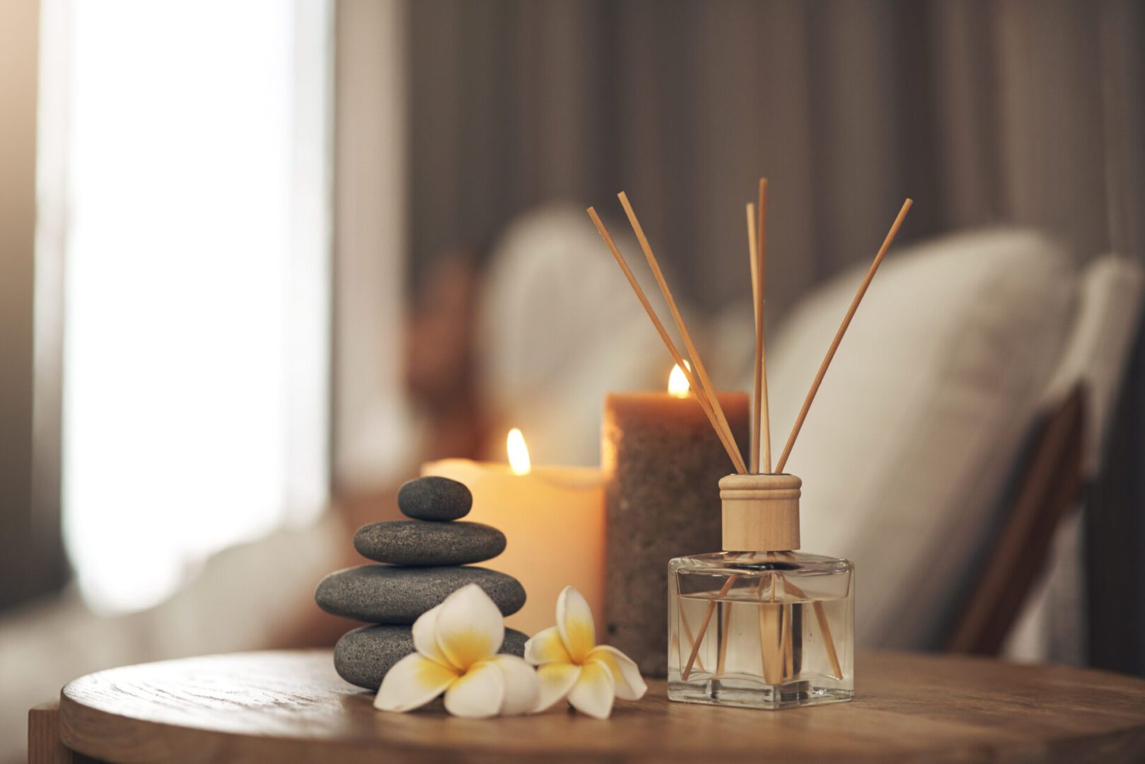 Spa setting with candles and flowers.